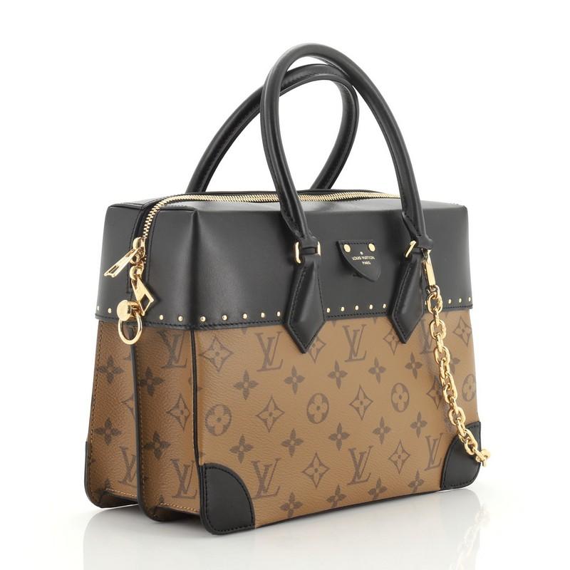 This Louis Vuitton City Malle Handbag Reverse Monogram Canvas and Leather MM, crafted in brown reverse monogram coated canvas and black leather, features dual rolled leather handles, mini stud detailing, and gold-tone hardware. Its zip closure opens