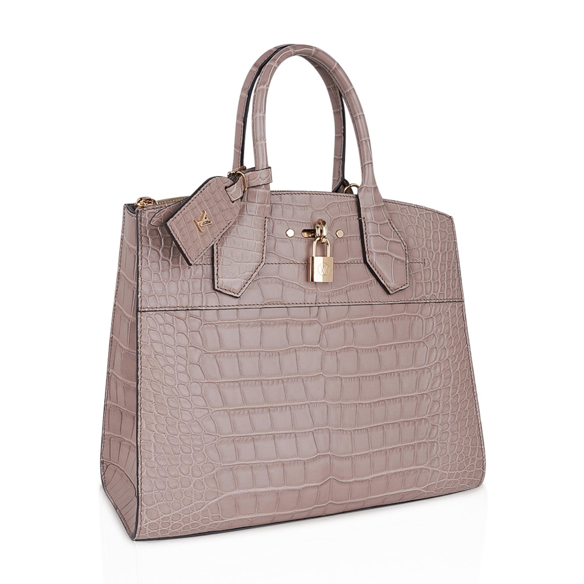 Mightychic offers a limited edition special order Louis Vuitton City Steamer MM featured in Taupe Matte exotic leather.
Inspired by Louis Vuitton luggage designed in 1901 for Cruise ship travel, Nicolas Ghesquiere created the City Steamer