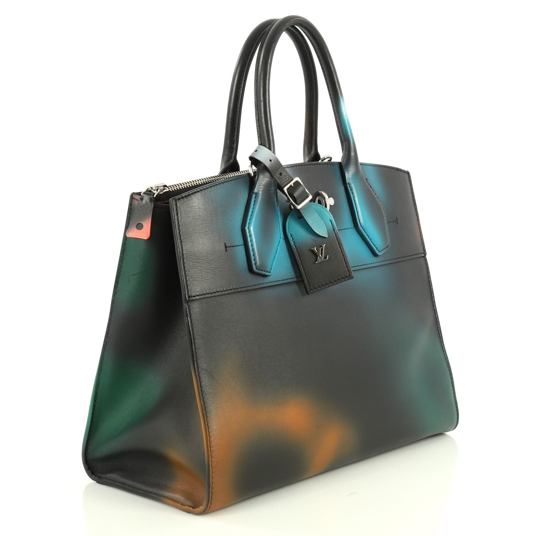 This Louis Vuitton City Steamer Handbag Hologram Print Leather MM, crafted in black leather with multicolor hologram print, features dual rolled leather handles, front central lock with LV stamped logo, protective base studs and silver-tone