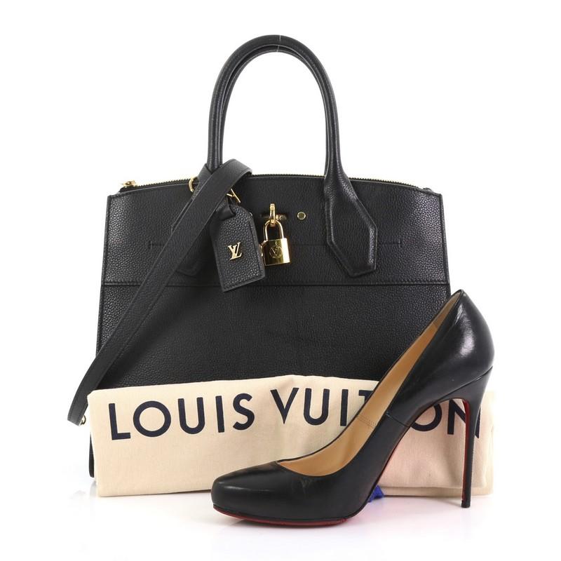 This Louis Vuitton City Steamer Handbag Leather MM, crafted from black leather, features dual rolled leather handles, front central lock with LV stamped logo, and gold-tone hardware. Its hook closure opens to a black leather interior with a rear zip
