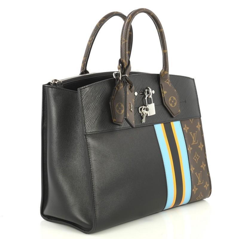 This Louis Vuitton City Steamer Handbag Limited Edition Monogram Canvas and Leather MM, crafted in brown monogram coated canvas and black and multicolor leather, features dual rolled leather handles, front central lock, and silver-tone hardware. Its