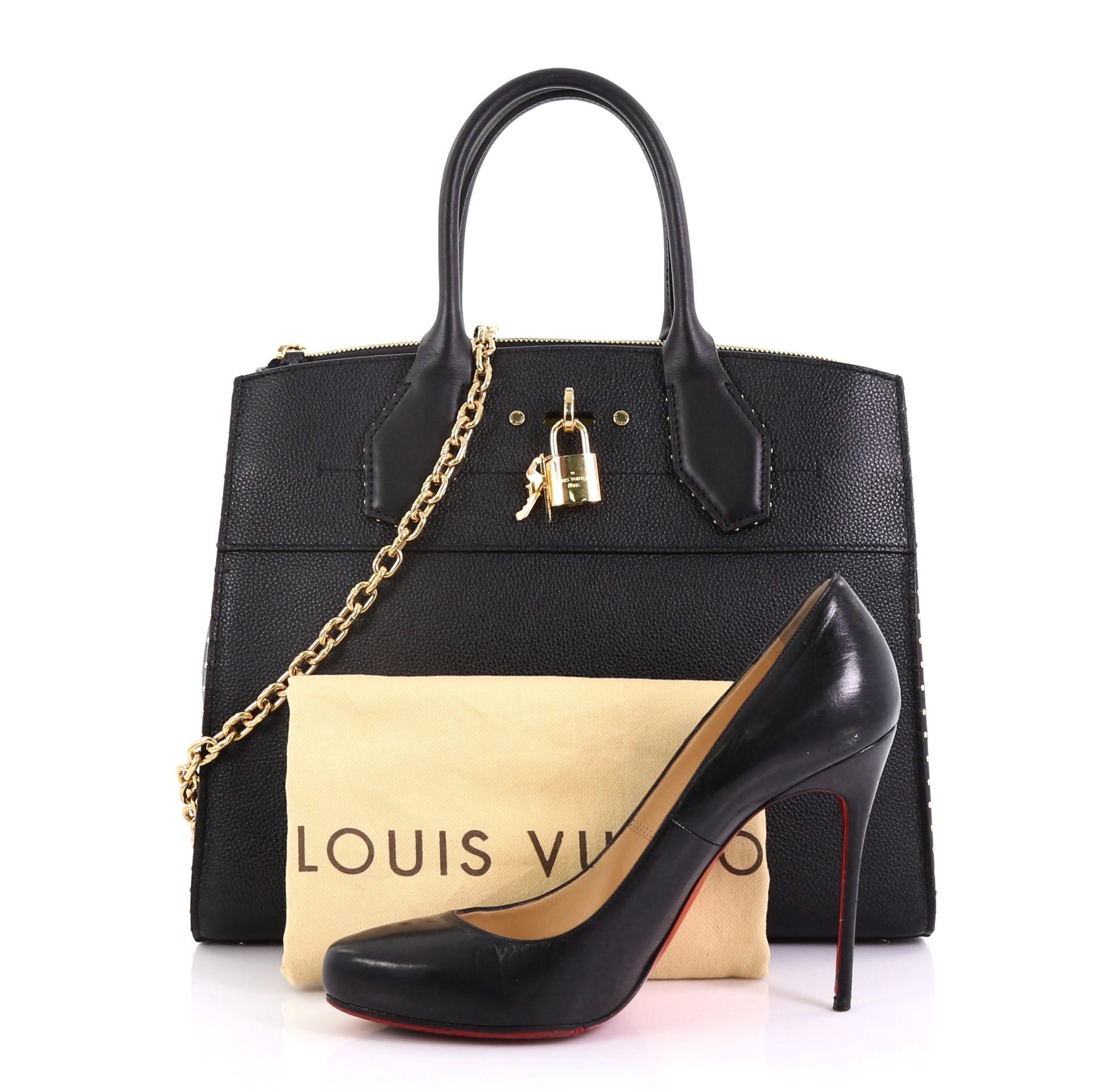 This Louis Vuitton City Steamer Handbag Studded Leather MM, crafted in black studded leather, features dual rolled leather handles, front central lock with LV stamped logo, and gold-tone hardware. It opens to a black leather interior with slip