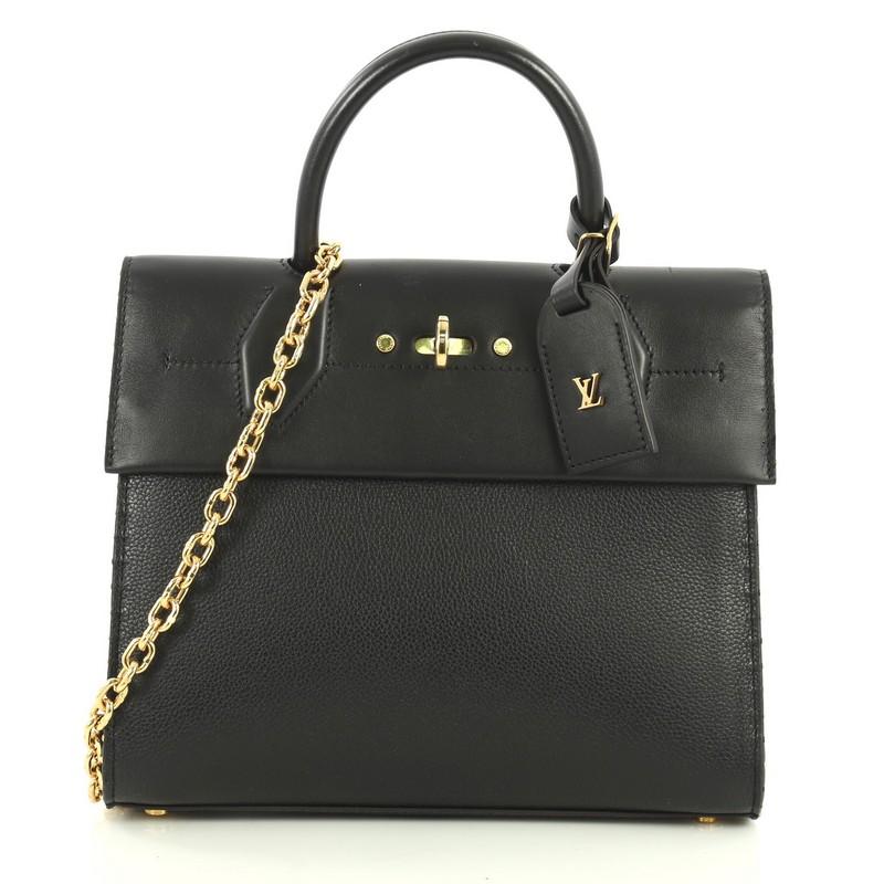 This Louis Vuitton City Steamer One Handle Bag Leather, crafted in black leather, features a single rolled top handle, protective base studs, exterior back zip pocket, and gold-tone hardware. Its turn-lock closure opens to a black leather interior