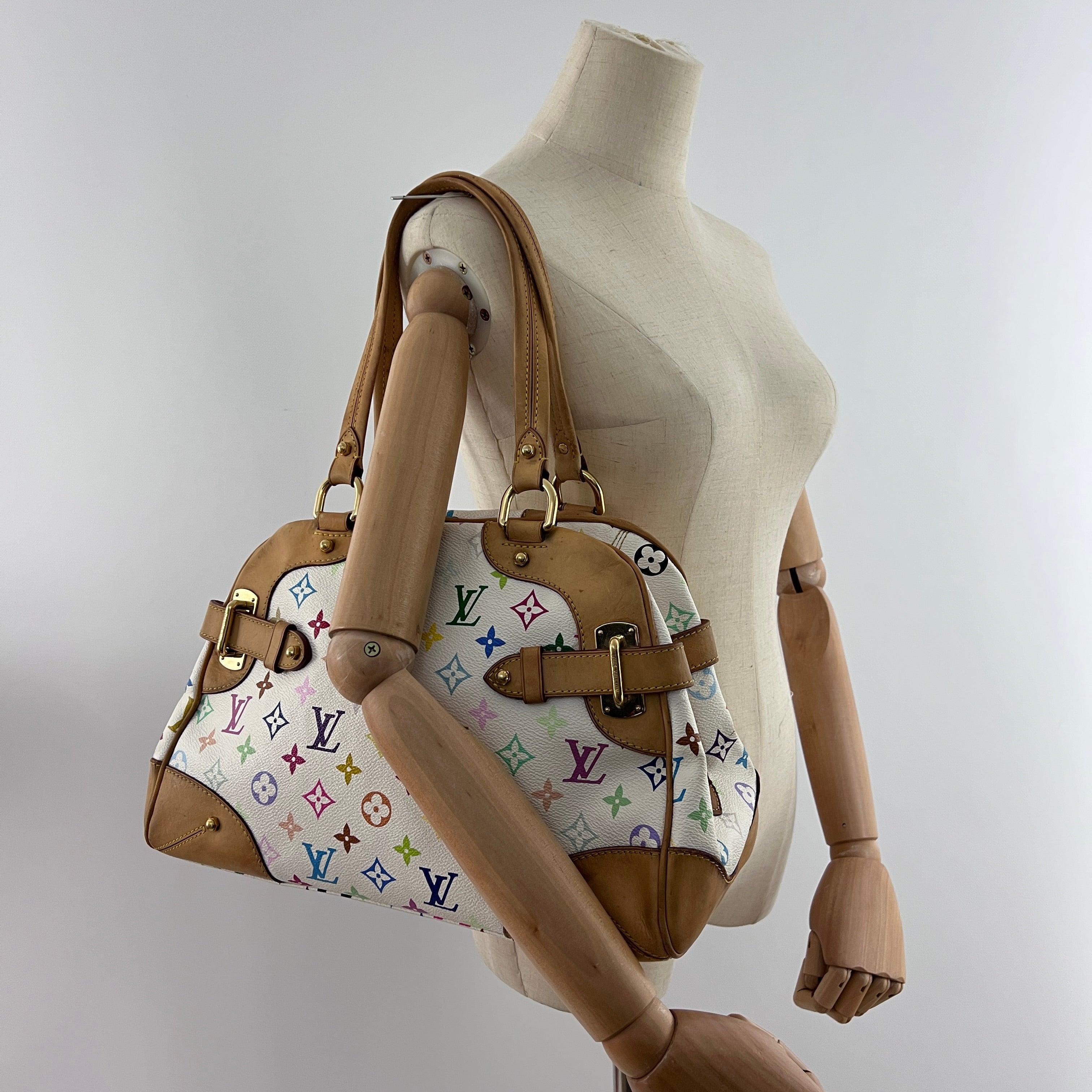 Louis Vuitton Claudia in monogram canvas with leather accents and gold-tone hardware. Top zip closure; roomy main compartment. Date code AS3150 (2010), made in France. Shoulder carry. Condition: good with attractive patina, light shaping and a few