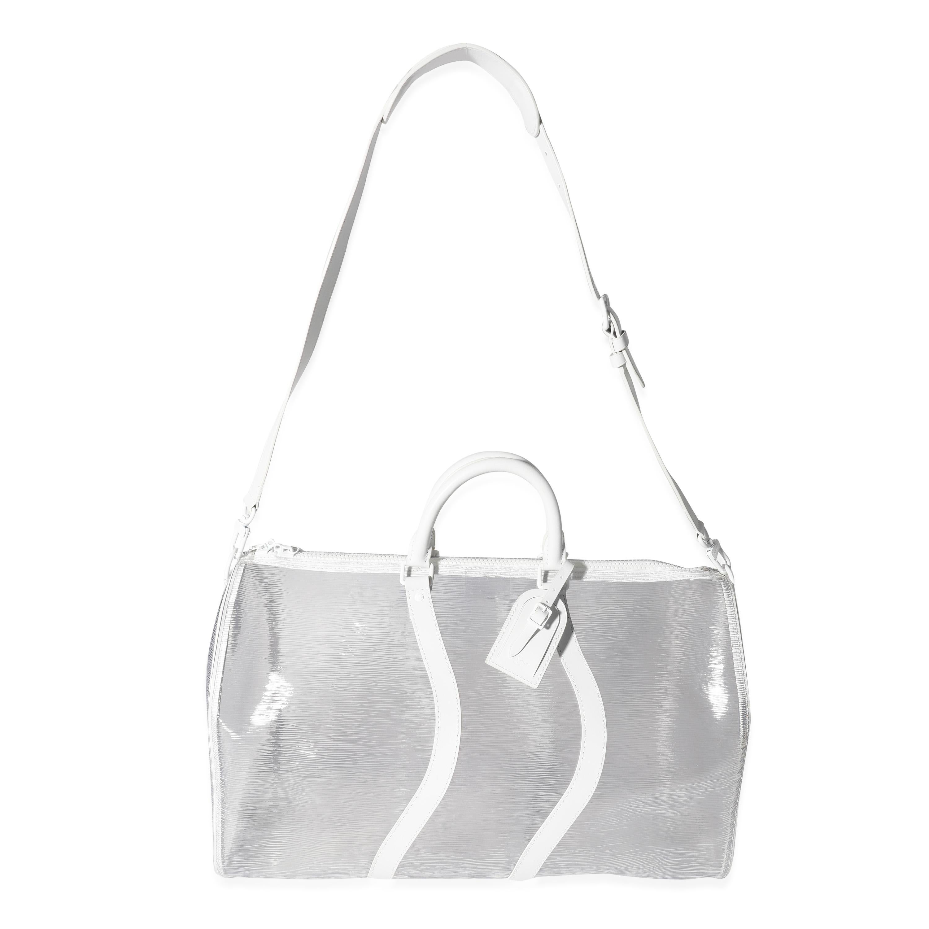 Listing Title: Louis Vuitton Clear Epi PVC Wavy Keepall Bandoulière 50
SKU: 119589
Condition: Pre-owned (3000)
Handbag Condition: Excellent
Condition Comments: Minor signs of use.
Brand: Louis Vuitton
Model: Wavy Keepall
Origin Country: