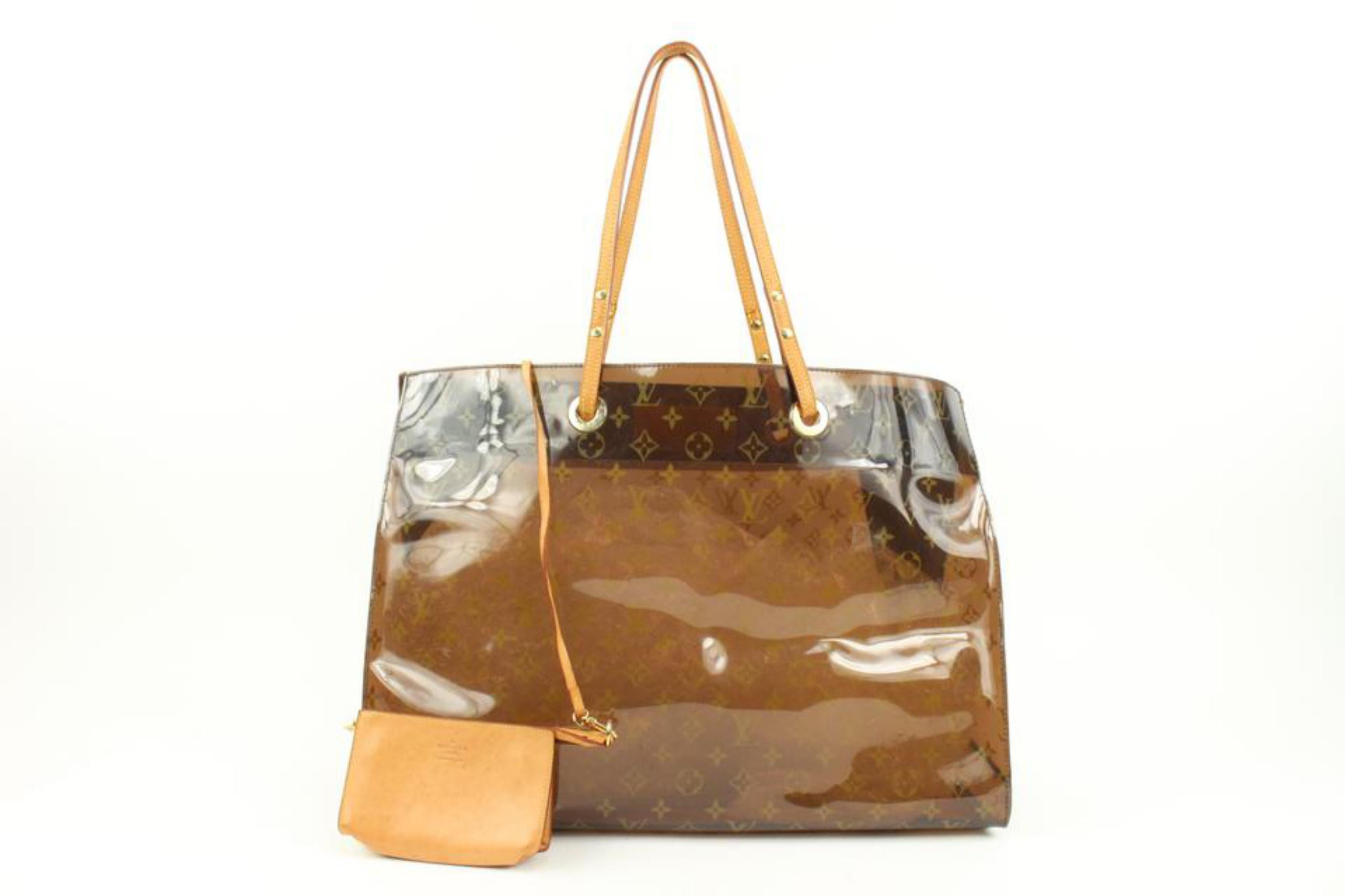 Louis Vuitton Clear Monogram Ambre Cabas Cruise GM Translucent Tote w Pouch s29lv31
Date Code/Serial Number: LW0040
Made In: Spain
Measurements: Length:  18.5