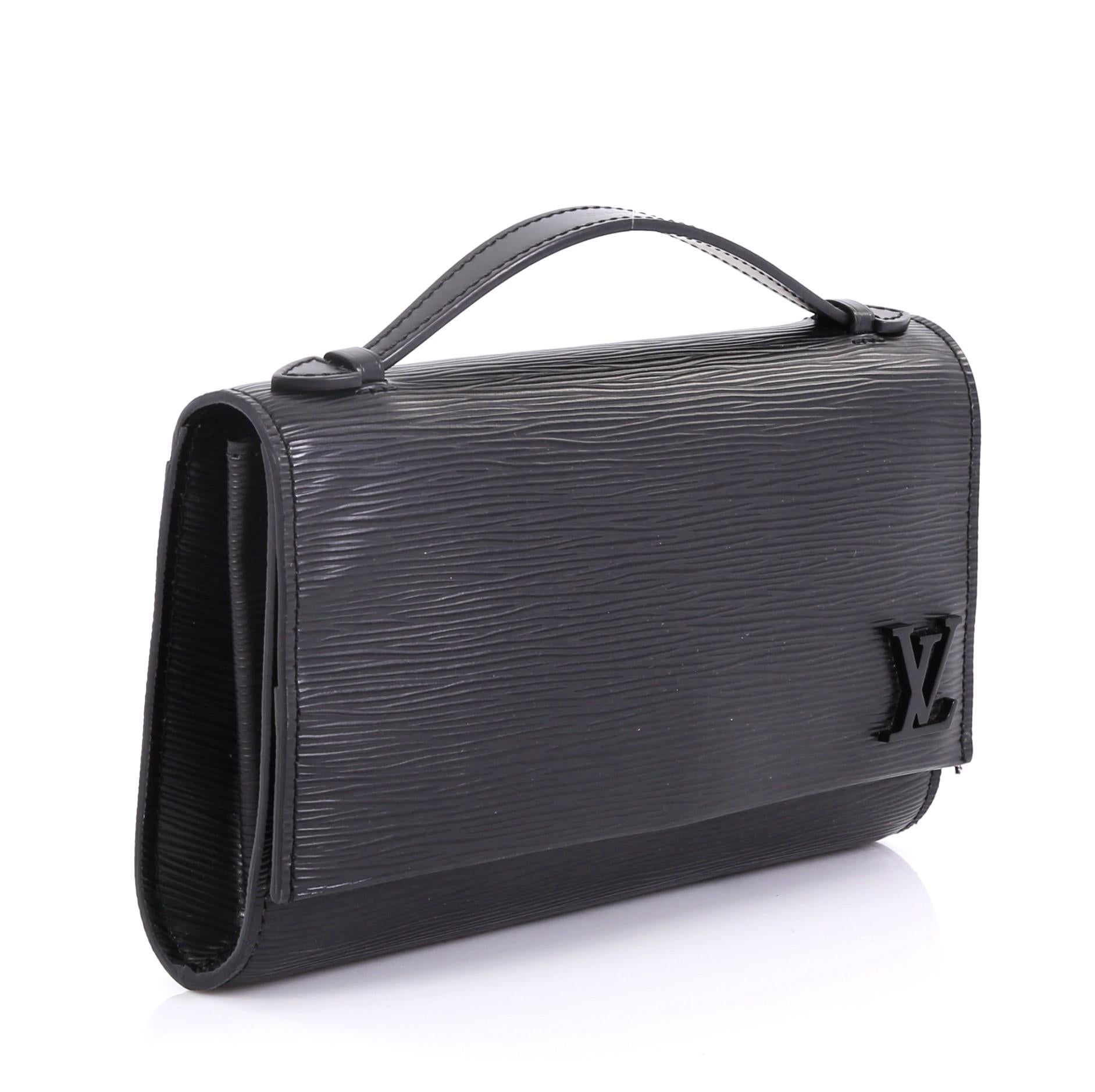 This Louis Vuitton Clery Handbag Epi Leather, crafted in black epi leather, features leather top handle, adjustable leather strap, frontal flap with subtle LV logo and silver-tone hardware. Its hidden magnetic snap closure opens to a black fabric