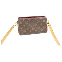 Louis Vuitton clutch with a strap in monogram canvas
