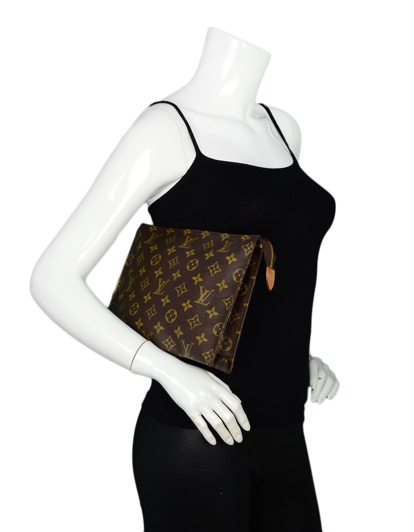 Louis Vuitton Coated Canvas Monogram Toiletry Pouch 26

Made In: France
Color: Brown
Hardware: Goldtone hardware
Materials: Monogram coated canvas, vachetta leather trim
Lining: Washable pebbled lining 
Closure/Opening: Top zipper closure 
Exterior