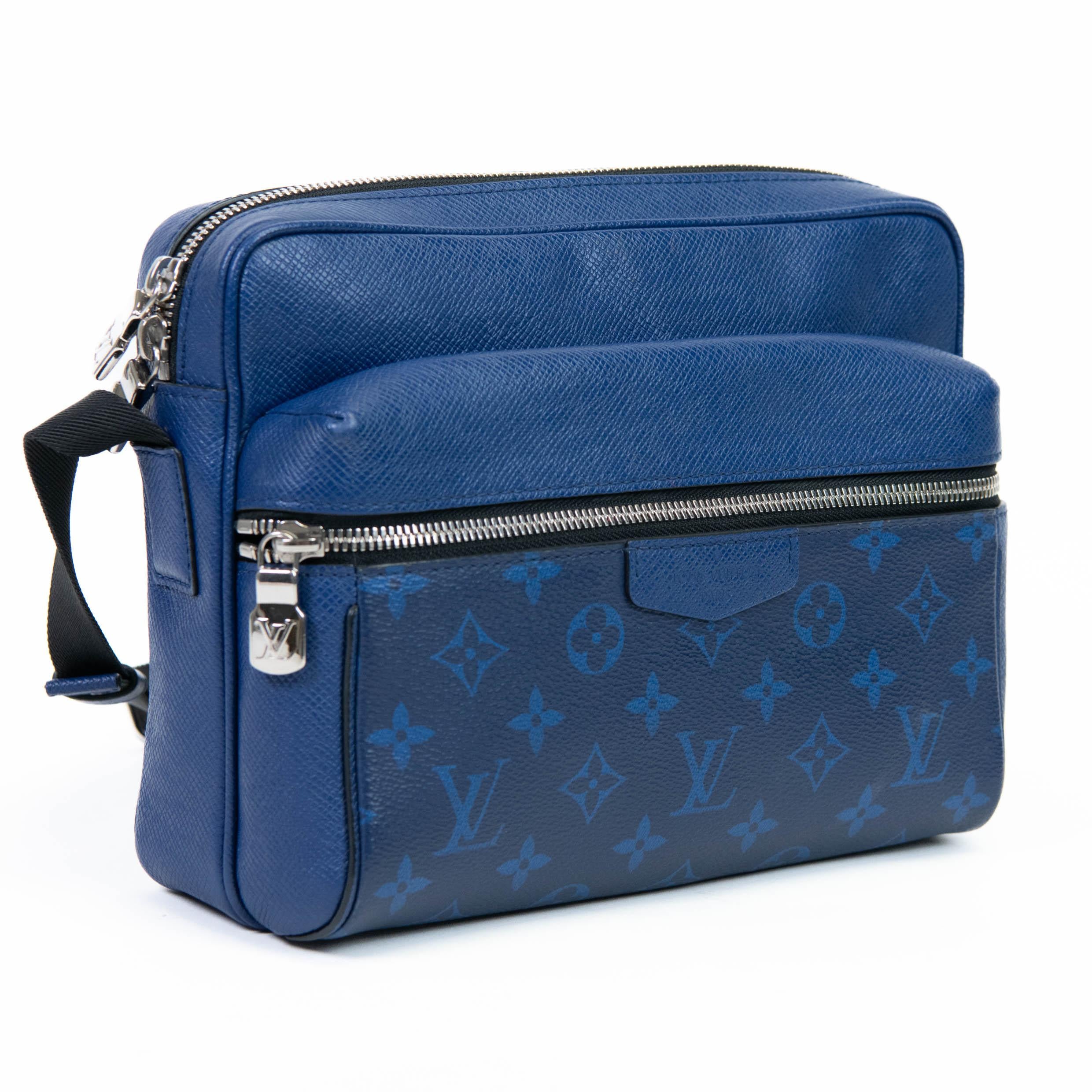 100% Authentic

This stylish shoulder bag is crafted of royal blue cross-grain taiga leather, with classic Louis Vuitton monogram coated canvas accents. The bag features a front zipper pocket and an adjustable coated canvas shoulder strap with