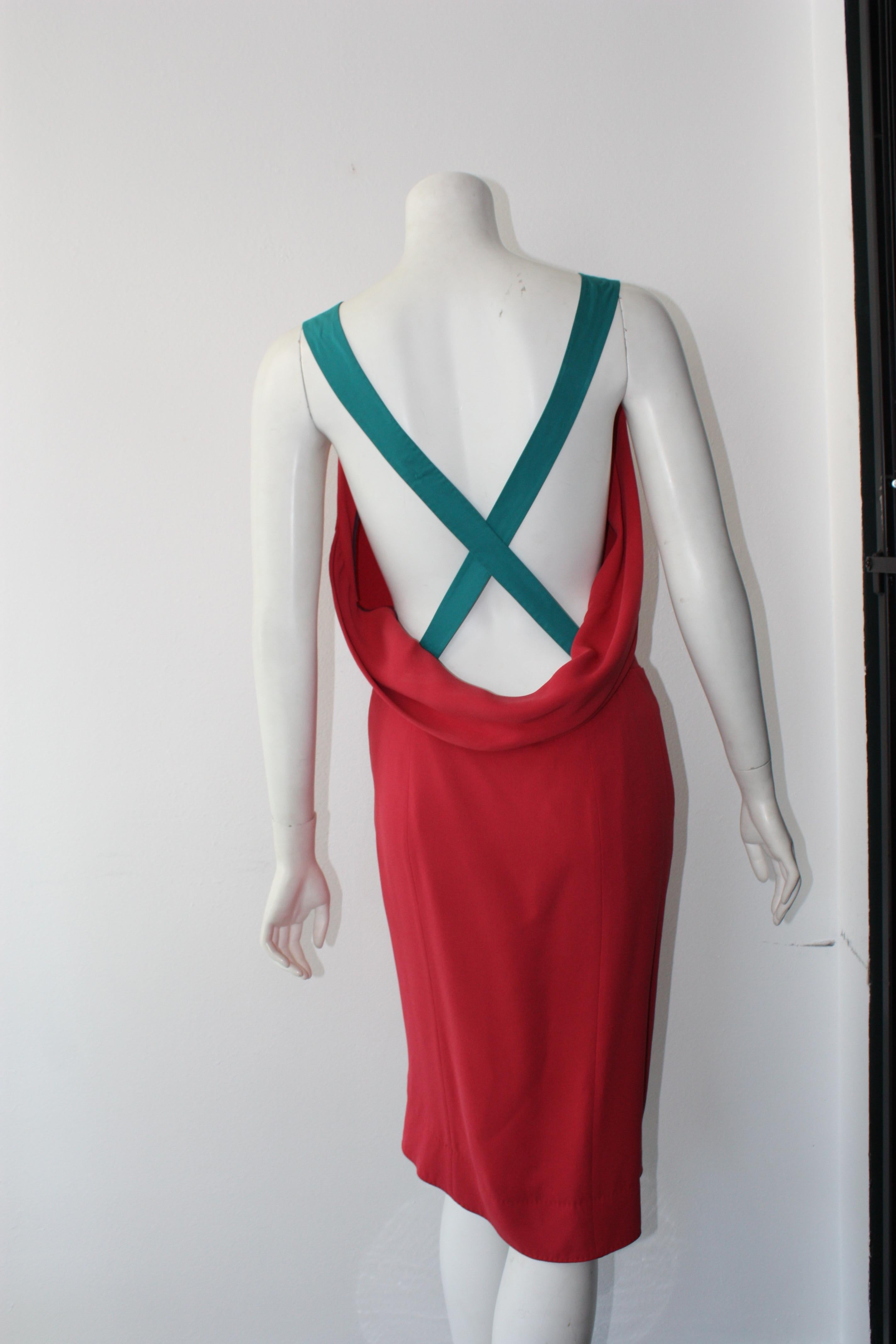 Louis Vuitton coral pink dress with teal cross over straps. Cowl back detail. Lower leg side slit. Right front pocket. 
Classy and Sexy in one ! Truly a very special piece.

100% silk. Lining 100% silk.

Size 36