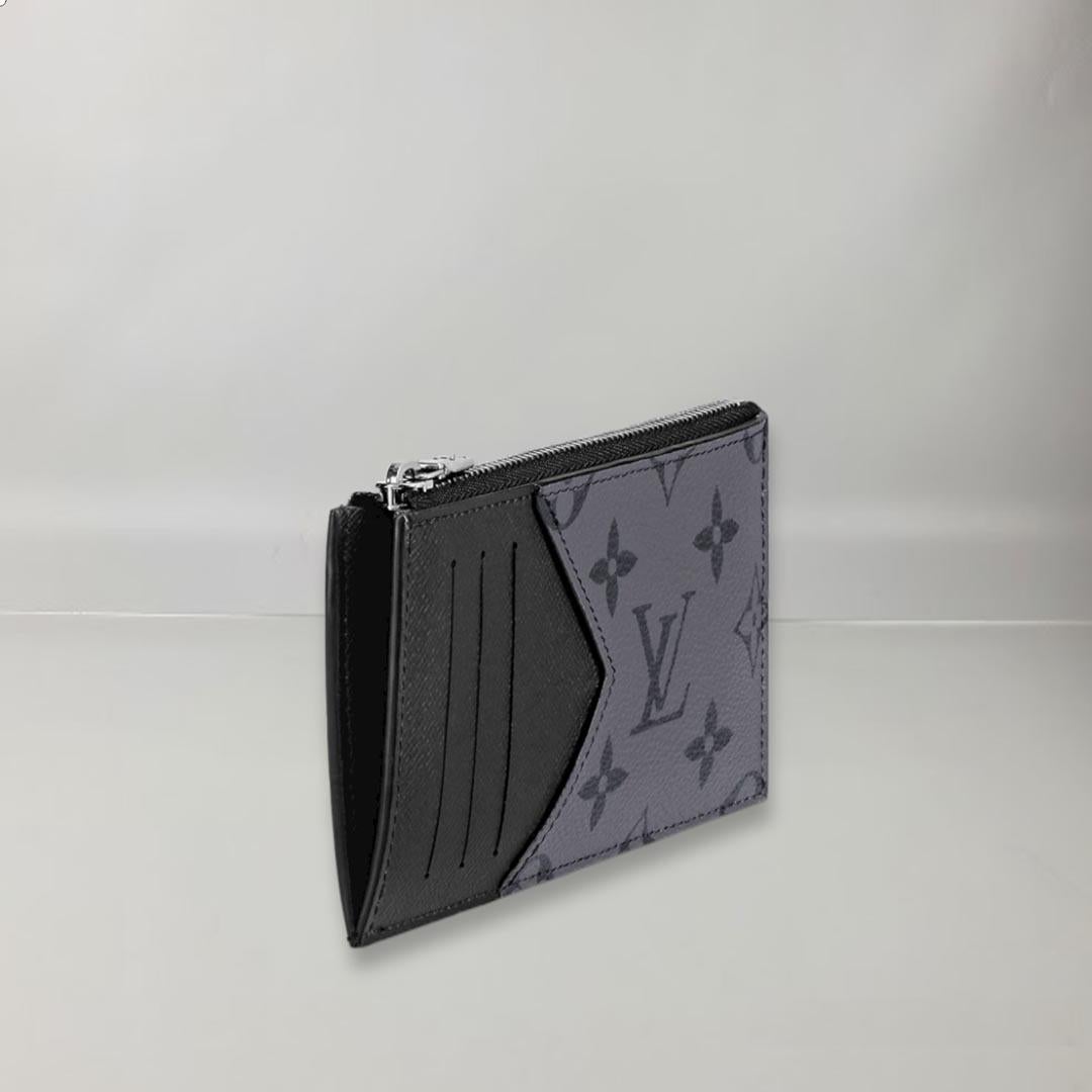 Crafted in dark Monogram Eclipse canvas and lighter colored Monogram Eclipse Reverse canvas, this slim purse and card holder has a clean, masculine look. Its streamlined design offers card slots, a zippered coin pocket and a bill compartment. The LV