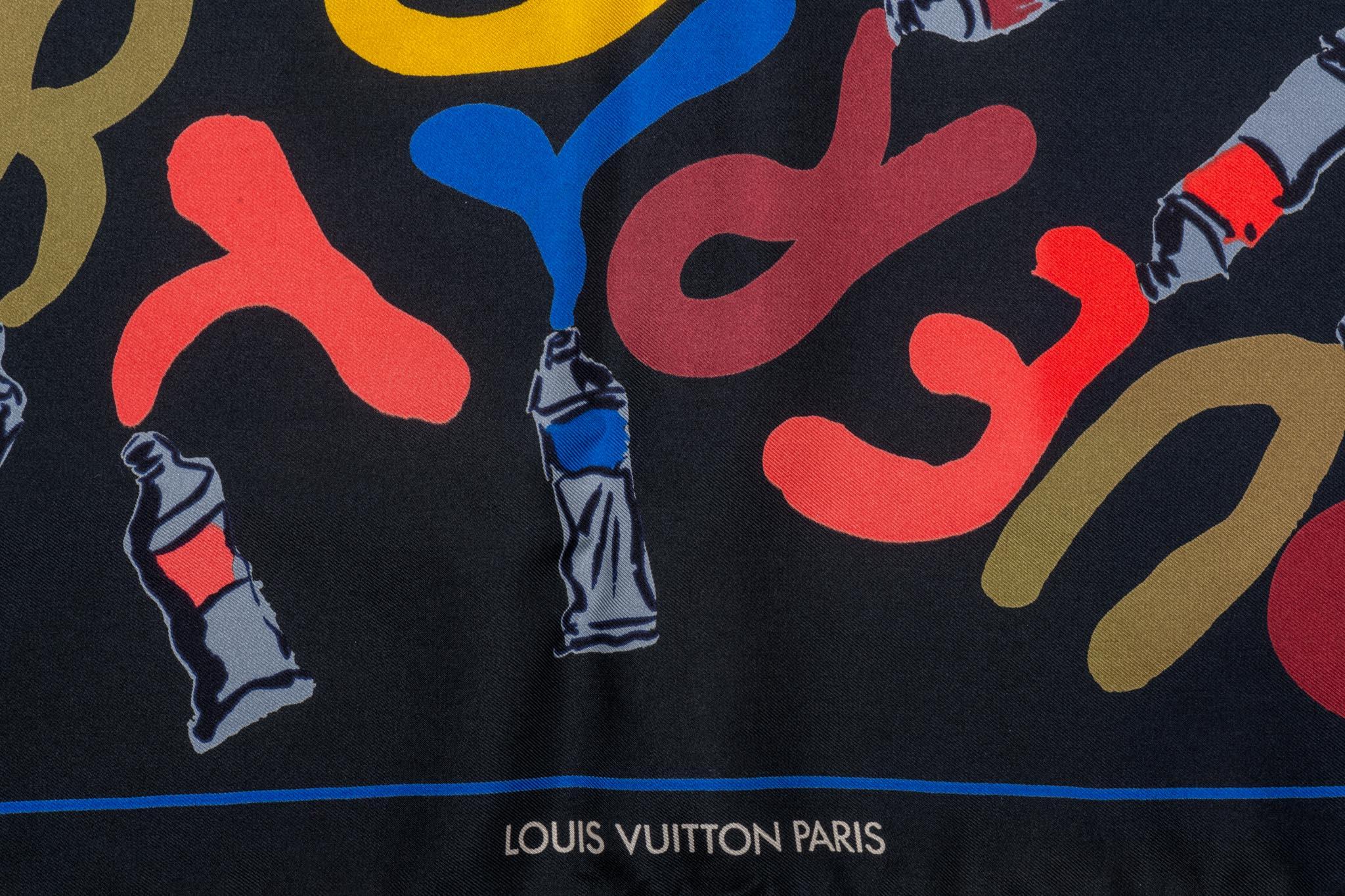 Louis Vuitton black silk scarf with multicolor lettering design. Hand rolled edges. Excellent condition.