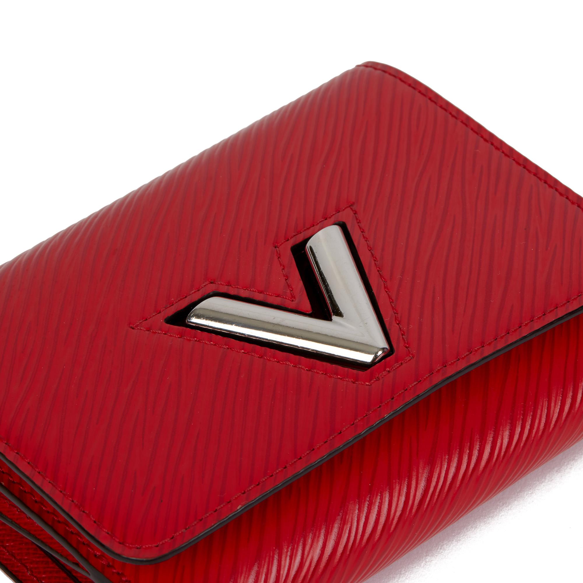 Louis Vuitton COQUELICOT EPI LEATHER TWIST COMPACT WALLET

CONDITION NOTES
The exterior is in excellent condition with minimal signs of use.
The interior is in excellent condition with minimal signs of use.
The hardware is in excellent condition