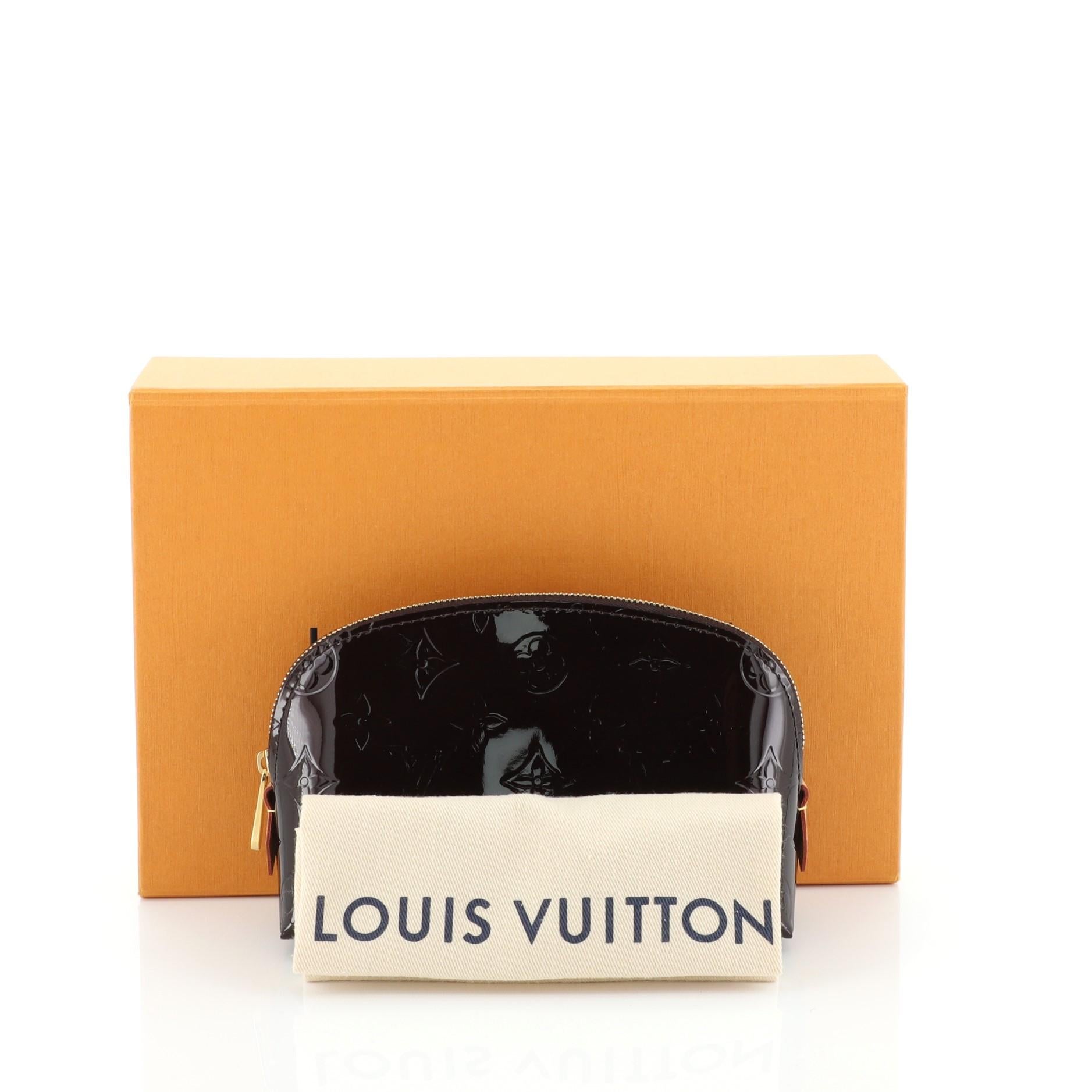 This Louis Vuitton Cosmetic Pouch Monogram Vernis, crafted in red monogram vernis, features gold-tone hardware. Its zip closure opens to a red leather interior with slip pocket. Authenticity code reads: SR0199. 

Estimated Retail Price: