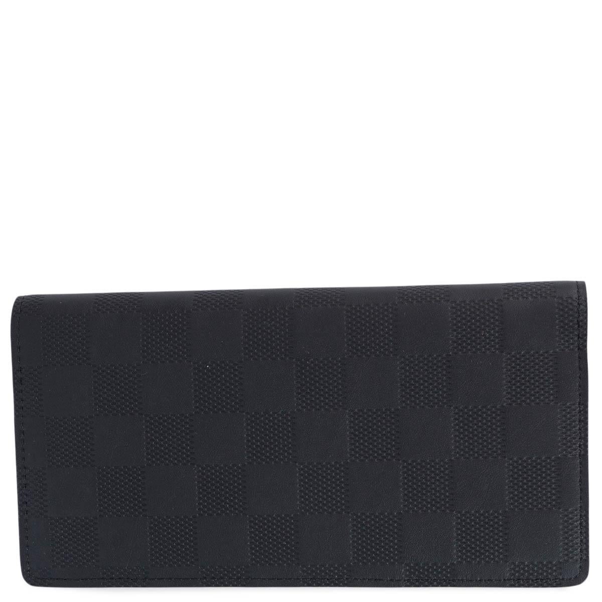 100% authentic Louis Vuitton Brazza wallet in Cosmos (black) Damier Infini leather. The Brazza wallet gives a classic Louis Vuitton pattern an understated twist and features 16 credit card slots, 1 gusseted bill compartment, 1 large zipped