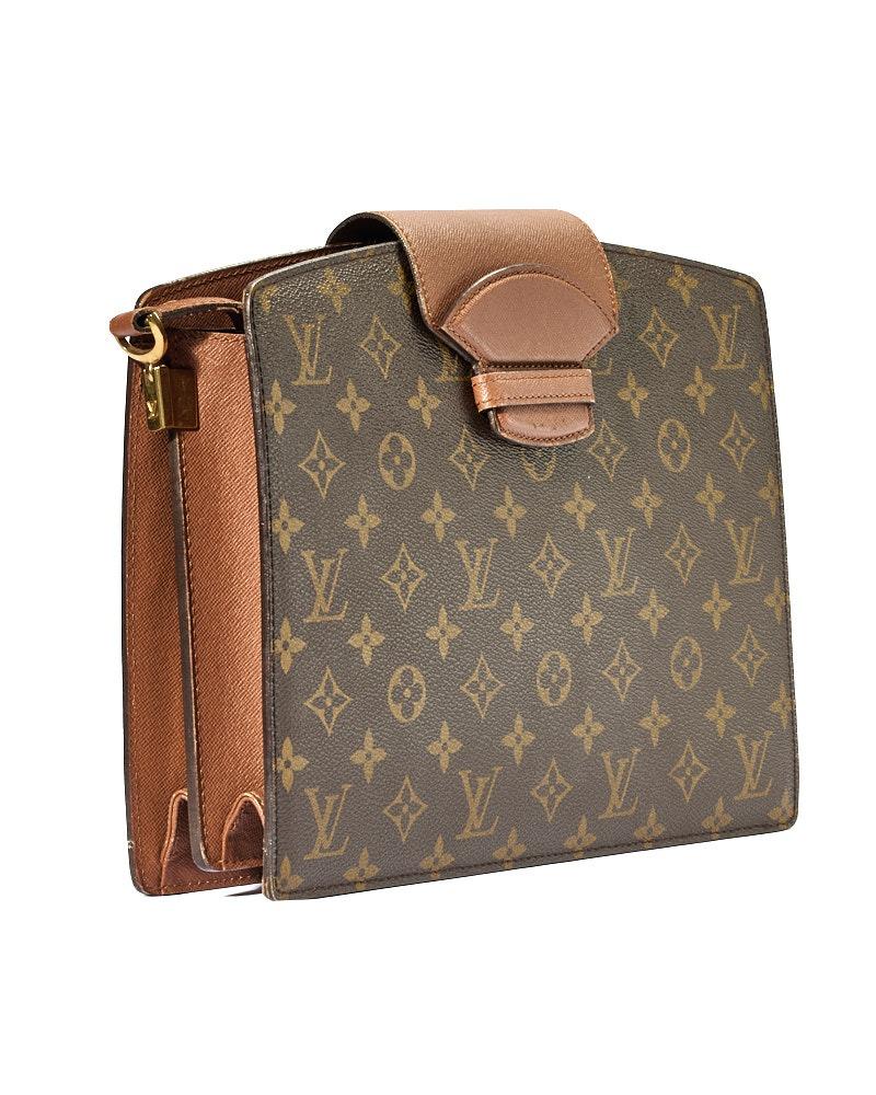 Louis Vuitton signature bag, Courcelles model in size MM, made of canvas in classic monogram pattern with cowhide inserts and gold hardware. Featuring an interlocking closure, internally lined in brown leather with convenient compartments, the bag