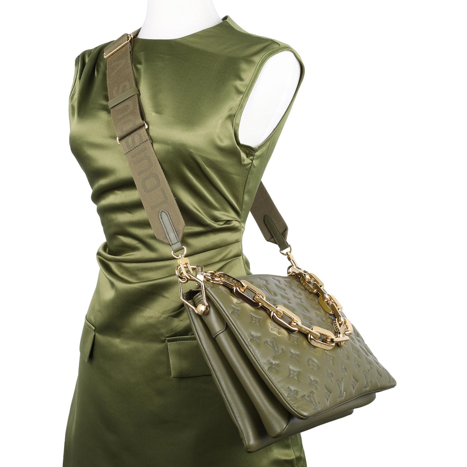 Authentic, pre-owned Louis Vuitton Coussin MM handbag in monogram embossed khaki. Features soft puffy lambskin in khaki green and embossed with the Louis Vuitton monogram, gold hardware, zipper top closure, green leather interior with middle zipper