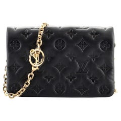 Louis Vuitton Coussin Pochette Monogrammiertes Lammfell mit Monogramm