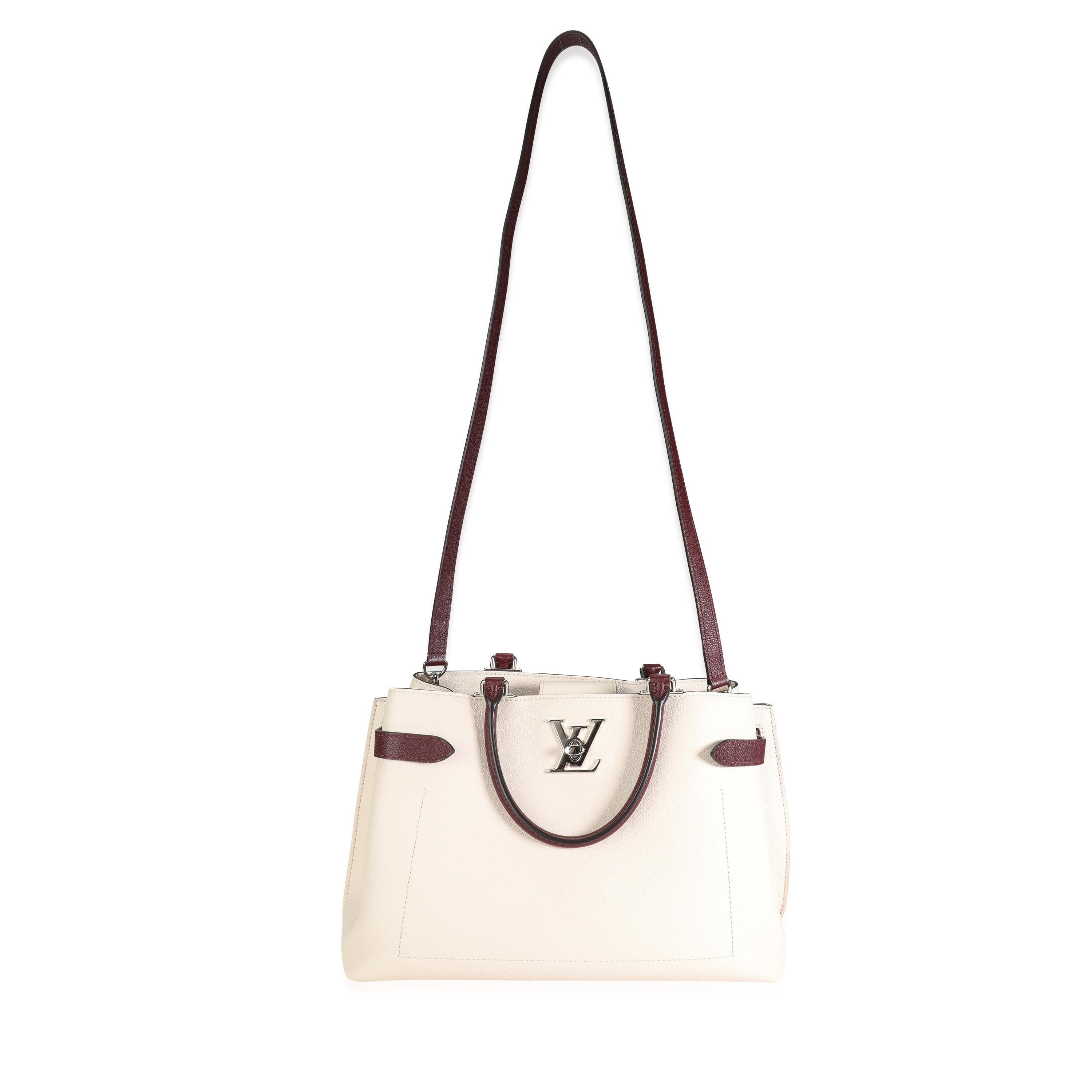 Listing Title: Louis Vuitton Cream & Burgundy Grained Calf Leather Lockme Day Bag
SKU: 117387
MSRP: 3200.00
Condition: Pre-owned (3000)
Handbag Condition: Very Good
Condition Comments: Very Good Condition. Scuffing to corners. Scratching to