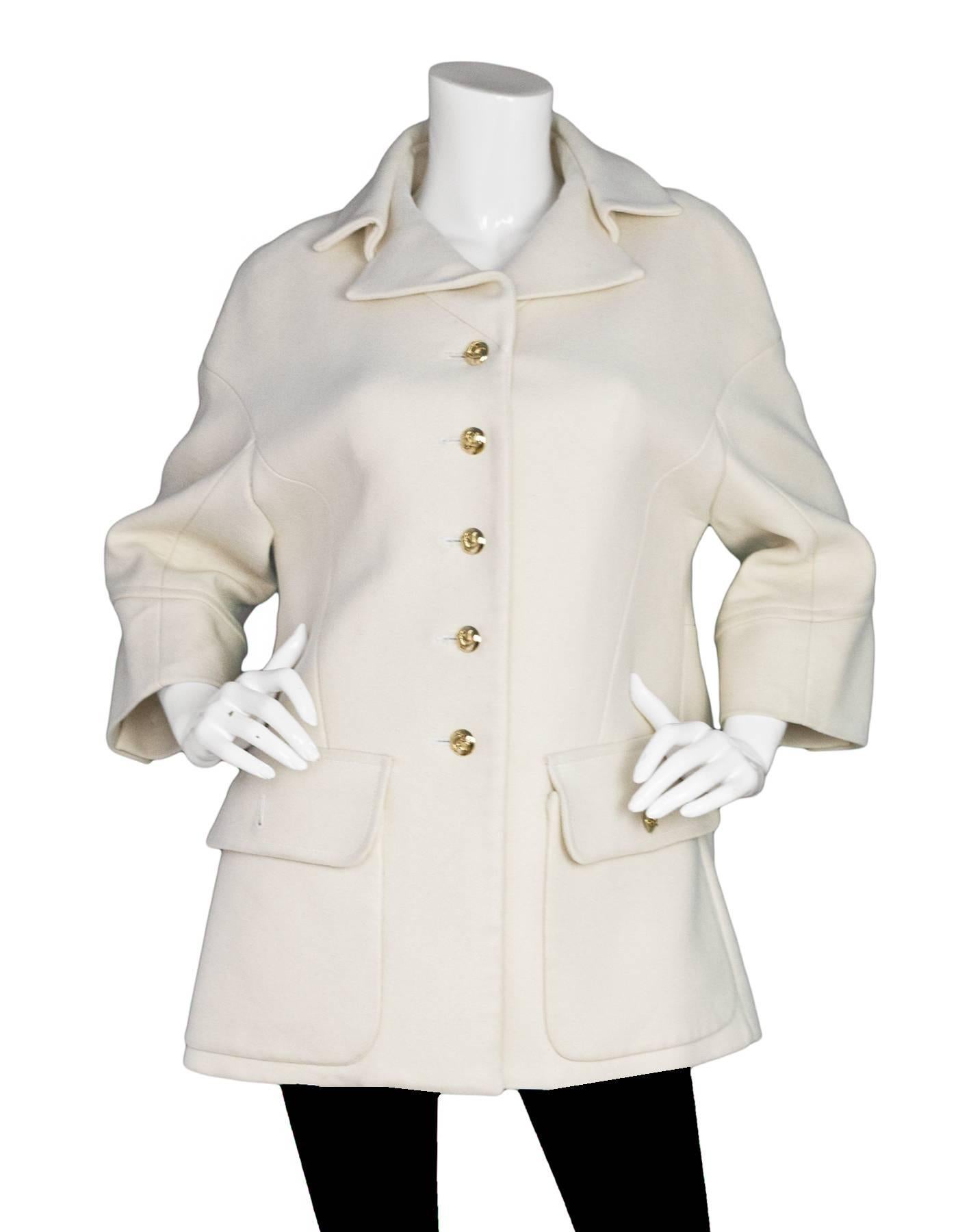 Louis Vuitton Cream Cashmere Coat Sz FR38

Made In: France
Color: Cream
Composition: 97% cashmere, 3% elastane
Lining: Cream textile
Closure/Opening: Front button closure
Exterior Pockets: Two hip flap pockets
Overall Condition: Very good pre-owned