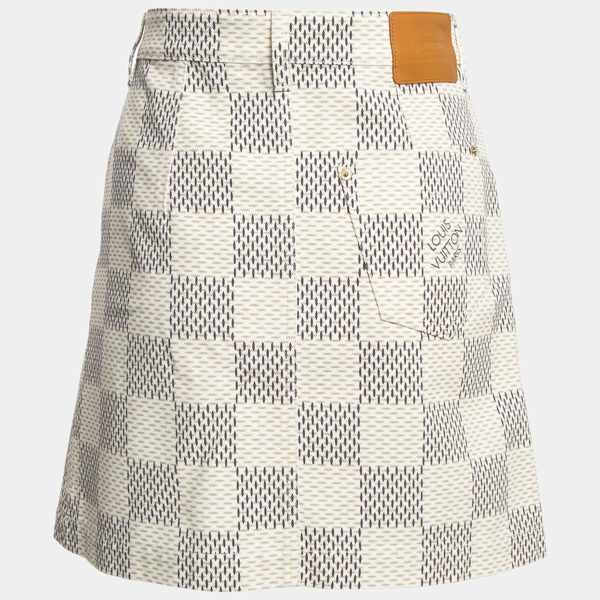 Indulge in the epitome of chic with the Louis Vuitton mini skirt. Crafted with exquisite attention to detail, this skirt features the iconic Damier Azur print on soft denim, exuding timeless elegance and effortless style for any occasion.

