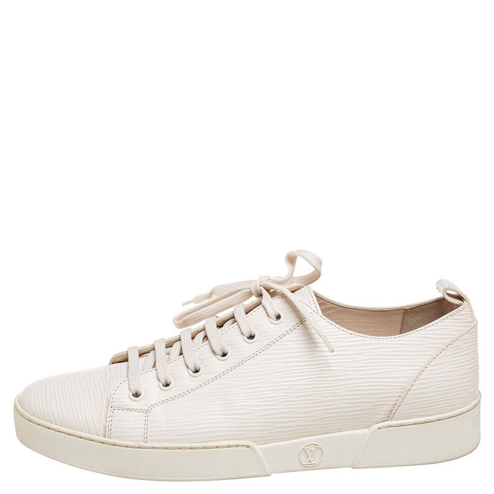 These on-trend sneakers have a clean, minimalist design which is complemented by Louis Vuitton's logo on the midsole. Crafted from Epi leather, the sneakers have leather lining on the insides as well and feature a sleek exterior pattern. Perfect