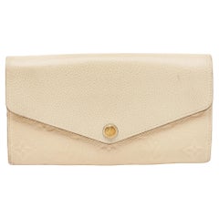 Louis Vuitton Cream Monogram Empreinte Leather Sarah Wallet