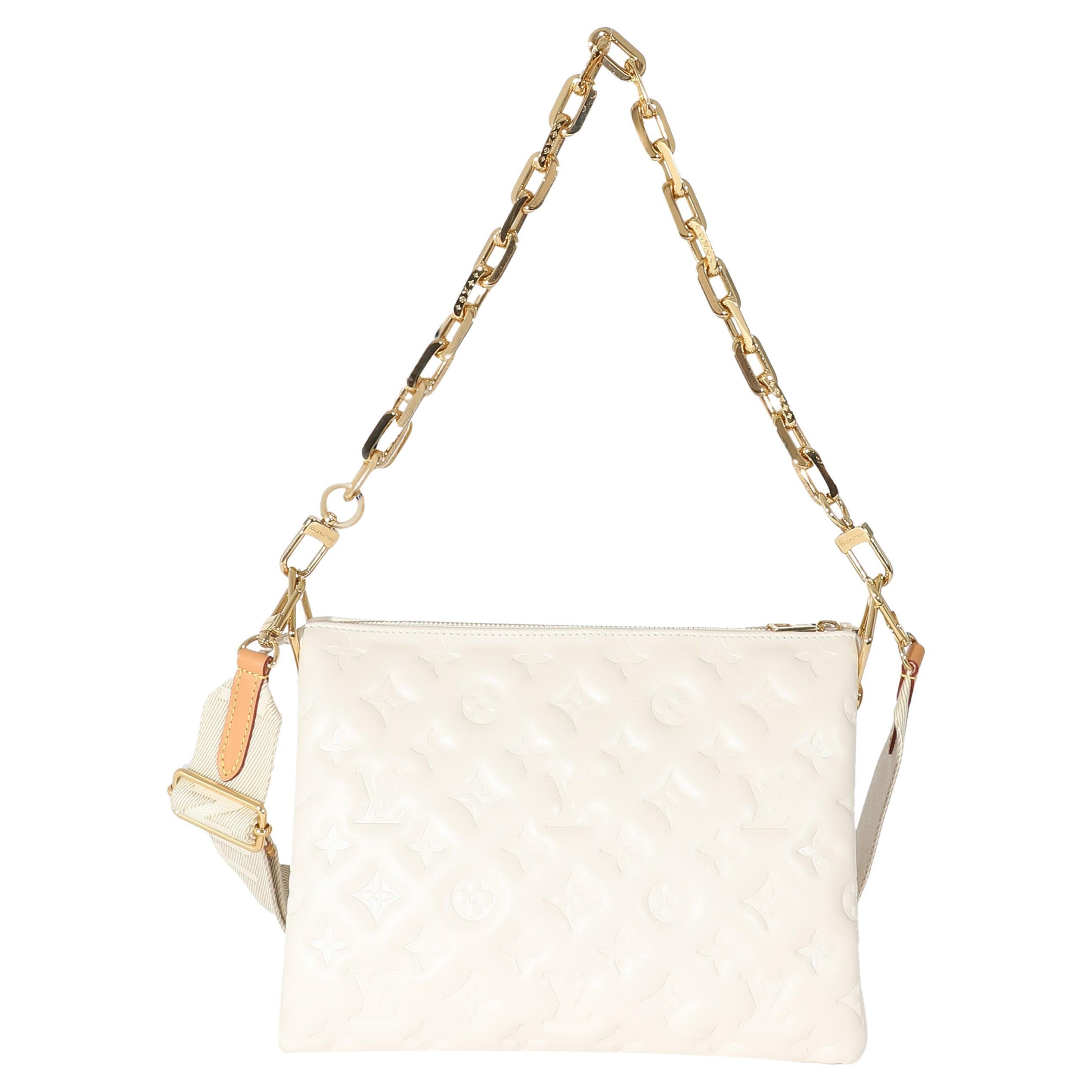 Listing Title: Louis Vuitton Cream Puffy Lambskin Monogram Coussin PM
SKU: 133492
MSRP: 4700.00 USD
Condition: Pre-owned 
Handbag Condition: Very Good
Condition Comments: Item is in very good condition with minor signs of wear. Discoloration and
