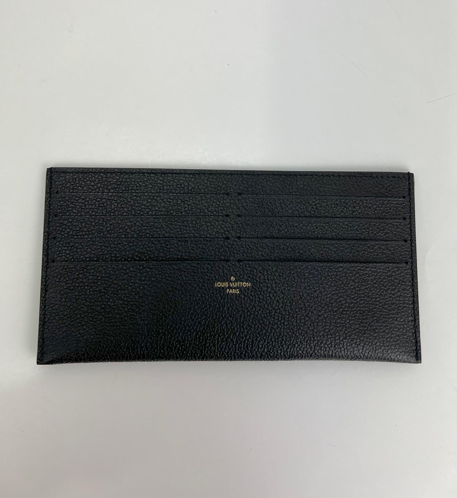  Like New 100% Authentic
Louis Vuitton Credit Card Insert Black
Empreinte Leather from Felicie
RATING: A...Excellent, near mint, shows slight 
sign of wear
MATERIAL:  empriente leather
COLOR: black
EXTERIOR: excellent
INTERIOR: like new
DATE CODE: