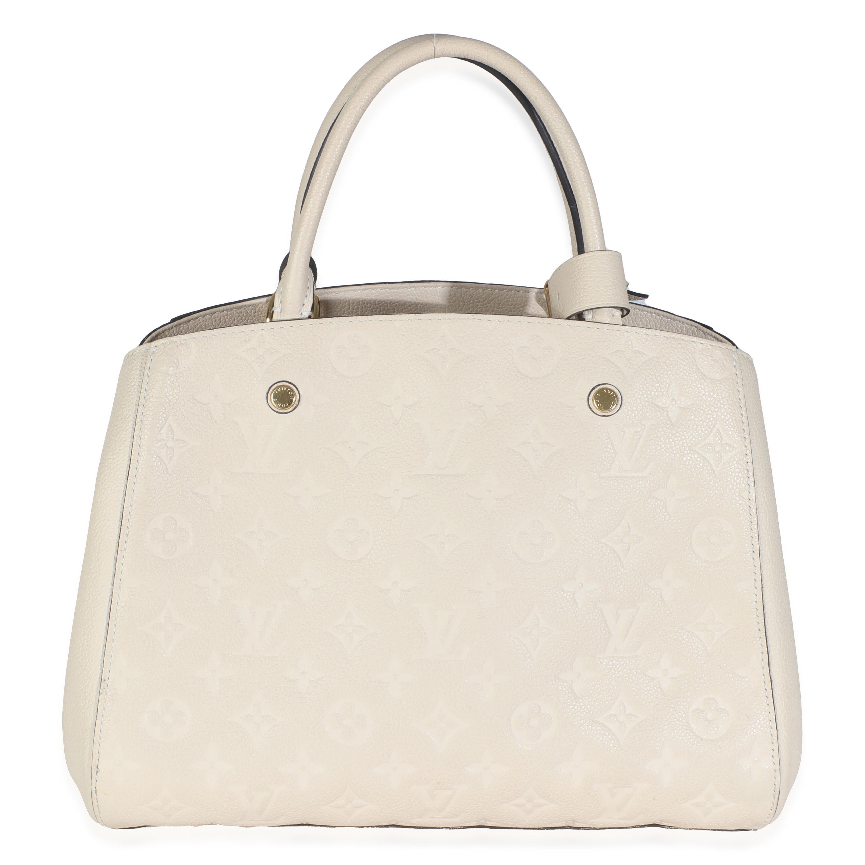 Listing Title: Louis Vuitton Creme Monogram Empreinte Montaigne MM
SKU: 145780
Condition: Pre-owned 
Handbag Condition: Very Good
Condition Comments: Item is in very good condition with minor signs of wear.  Strap Not Included. Light scuffing along