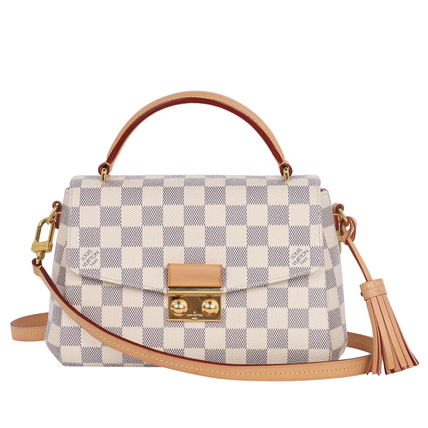 Authentic, pre-owned Louis Vuitton Damier Azur Croisette shoulder crossbody bag. Features classic Louis Vuitton Azur canvas with vachetta cowhide leather shoulder strap, top handle with polished brass hardware, front flap buckle top closure, pink