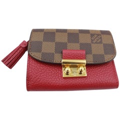 Louis Vuitton Croisette Wallet in Damier ébène and red leather.
