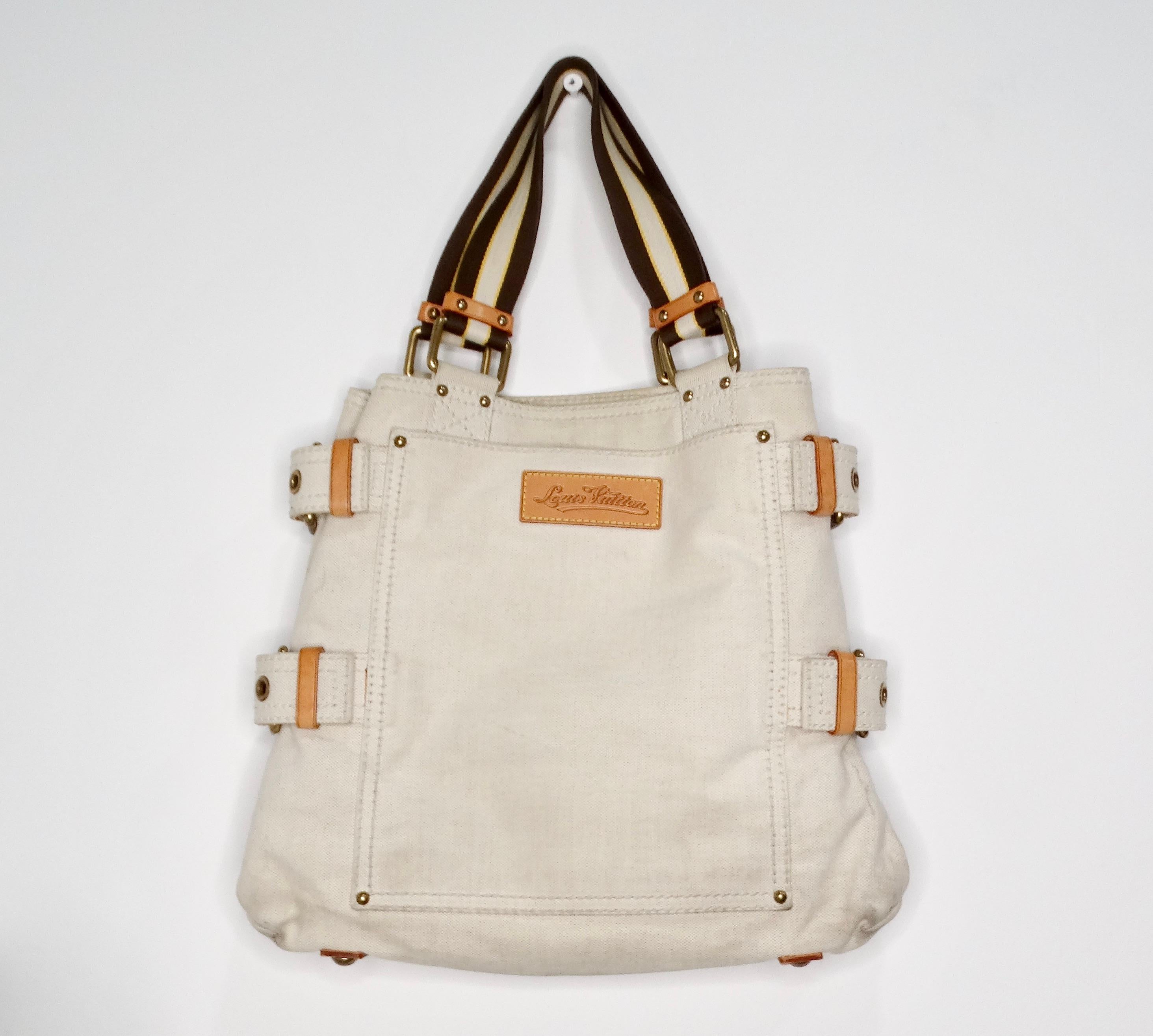 The Louis Vuitton Cruise Line Globe Shopper Canvas PM Cream Tote Bag is a stunning blend of luxury and functionality, making it a must-have for the fashionable individual. Crafted with a creamy canvas base, this tote features a playful red-tinted