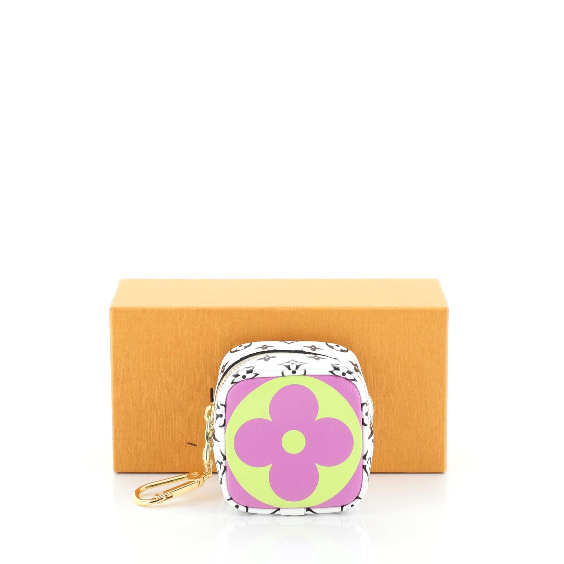 
This Louis Vuitton Cube Coin Purse Limited Edition Colored Monogram Giant, crafted in white and multicolor monogram coated canvas, features hook on a chain accent and gold-tone hardware. Its zip closure opens to a green microfiber interior.