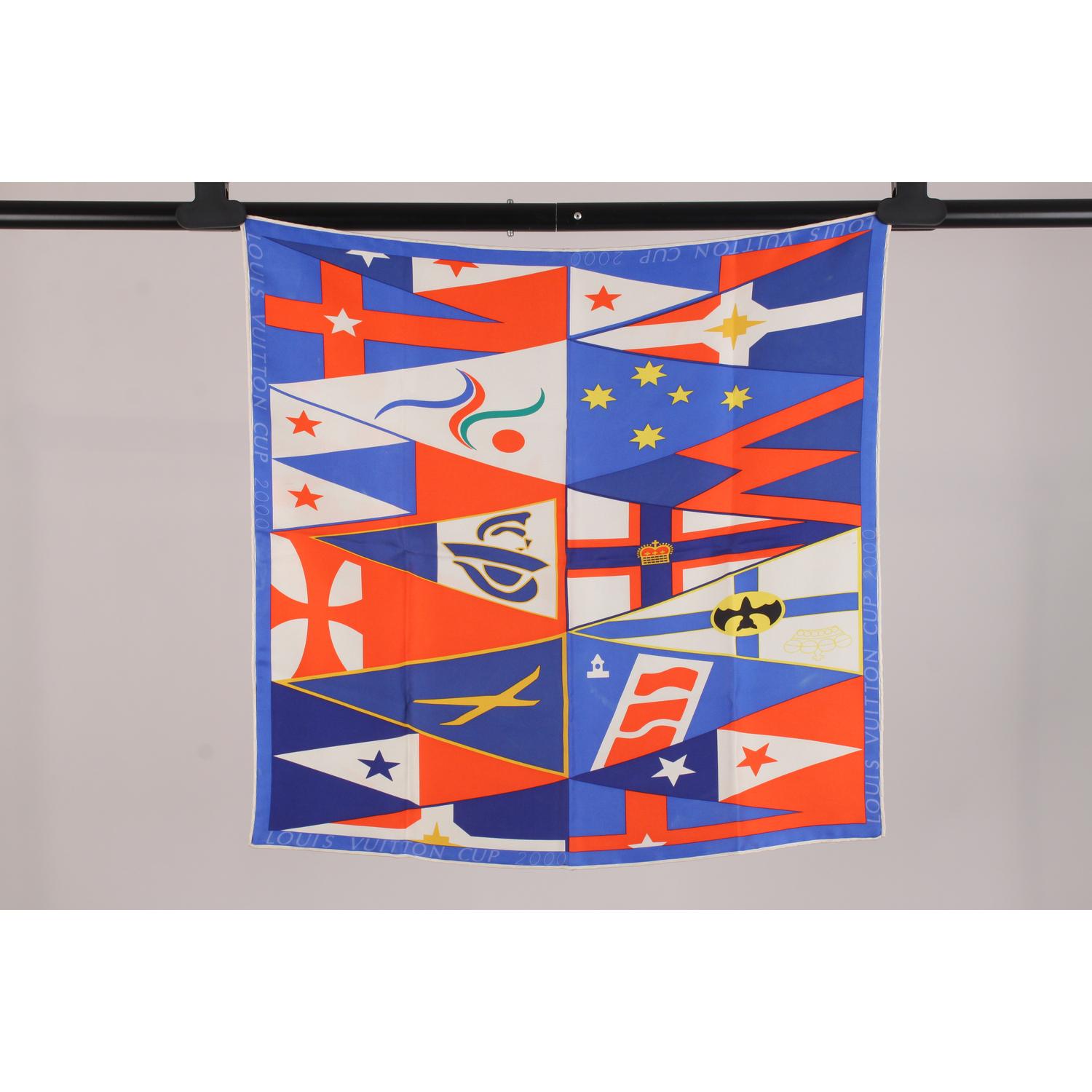 Limited Edition LOUIS VUITTON Silk Cup Scarf. A collector's piece created by Louis Vuitton for the the 2000 America's Cup annual sailing race (held in Auckland, New Zeland).  Crafted in 100% pure silk, it depicts a variety of nautical flags in