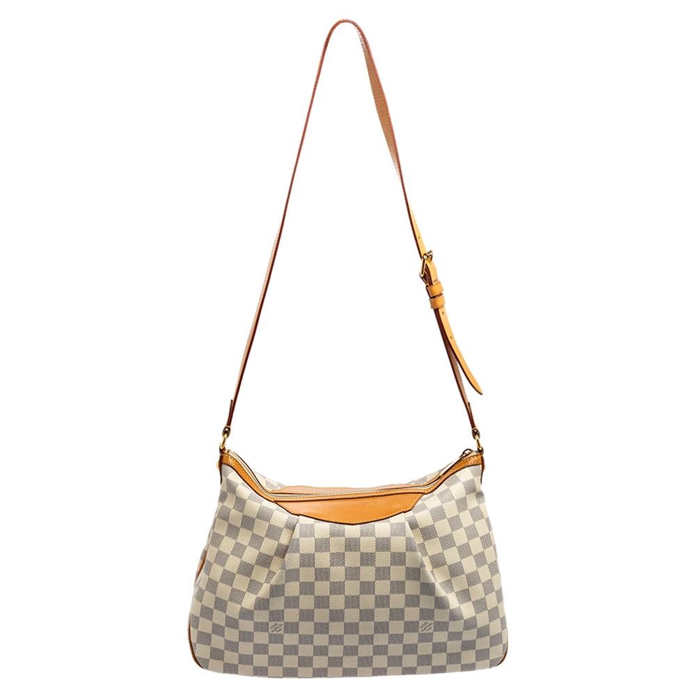 Louis Vuitton’s Siracusa MM bag is a sophisticated accessory that every fashionista needs to own! It is created using Damier Azur canvas and leather on the exterior and comes with gold-toned fittings. It comes with an adjustable shoulder strap. Like