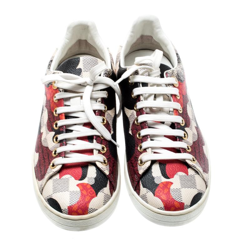 Ace the sneaker-game in this fabulous pair from Louis Vuitton! These sneakers are crafted from signature Damier Azur coated canvas and leather trims featuring a multicolored print all over. They have round toes and lace-ups on the vamps. They come