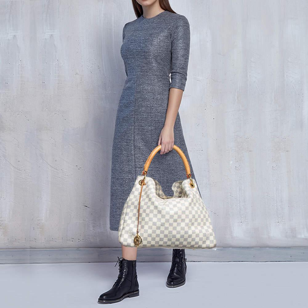 Indulge in luxury with this LV bag. Meticulously crafted from premium materials it combines exquisite design impeccable craftsmanship and timeless elegance. Elevate your style with this Artsy.