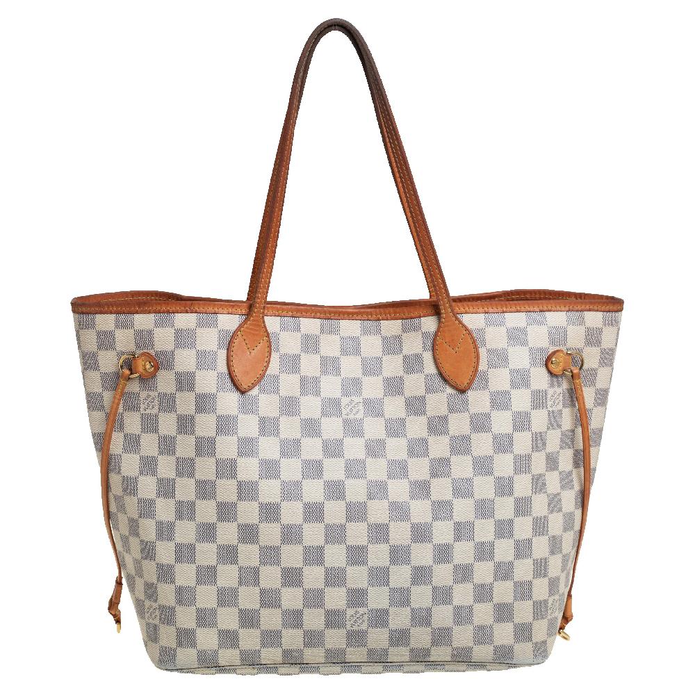 Louis Vuitton’s Neverfull was first introduced in 2007, and even today it is a popular design. Crafted from Damier Azur canvas, this Neverfull is gorgeous. The bag has drawstrings on the sides, a spacious interior that can house all your essentials