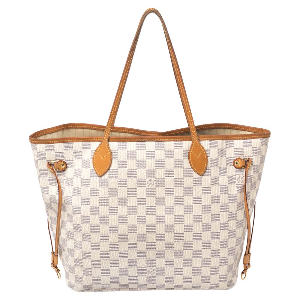 Louis Vuitton’s Neverfull was first introduced in 2007, and even today it is a popular design. Crafted from Damier Azur canvas, this Neverfull is gorgeous. The bag has drawstrings on the sides, a spacious interior that can house all your essentials,