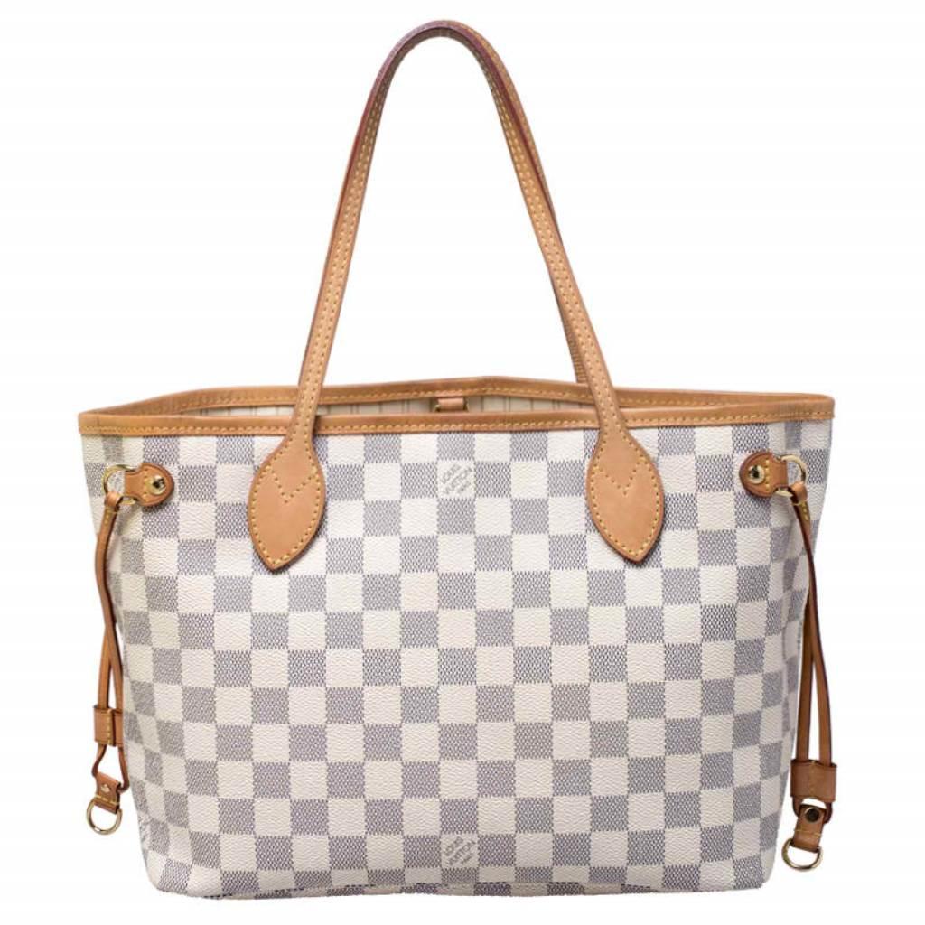 Louis Vuitton’s Neverfull was first introduced in 2007, and even today it is a popular design. Crafted from Damier Azur canvas, this Neverfull is gorgeous. The bag has drawstrings on the sides, a spacious canvas interior that can house all your