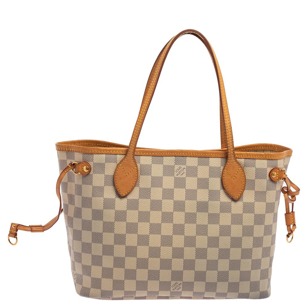 Louis Vuitton’s Neverfull was first introduced in 2007, and even today, it is a popular design. Crafted from Damier Azur canvas, this bag is gorgeous in appeal. It has drawstrings on the sides for the desired frame, a spacious canvas-lined interior