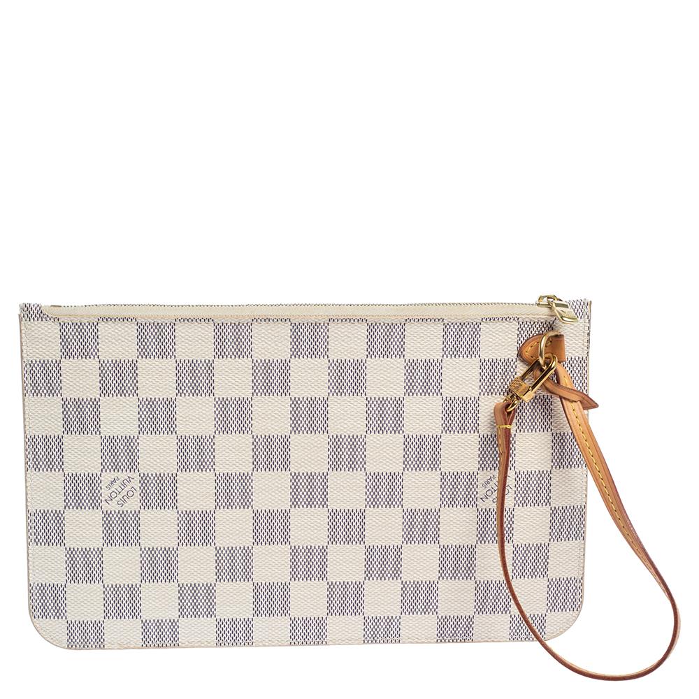 The exclusive Neverfull clutch from the house of Louis Vuitton is a stylish way to carry your basics. The clutch is crafted from the signature Damier Azur canvas body that imparts grace, while the gold-tone top zip closure adds the perfect contrast