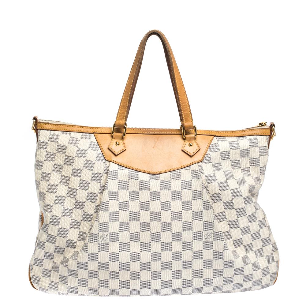 Like every other Louis Vuitton creation, this Siracusa bag also promises high quality and a timeless style. Crafted from signature Damier Azur canvas, the bag flaunts leather dual handles. The canvas-lined interior is sized to hold your necessities