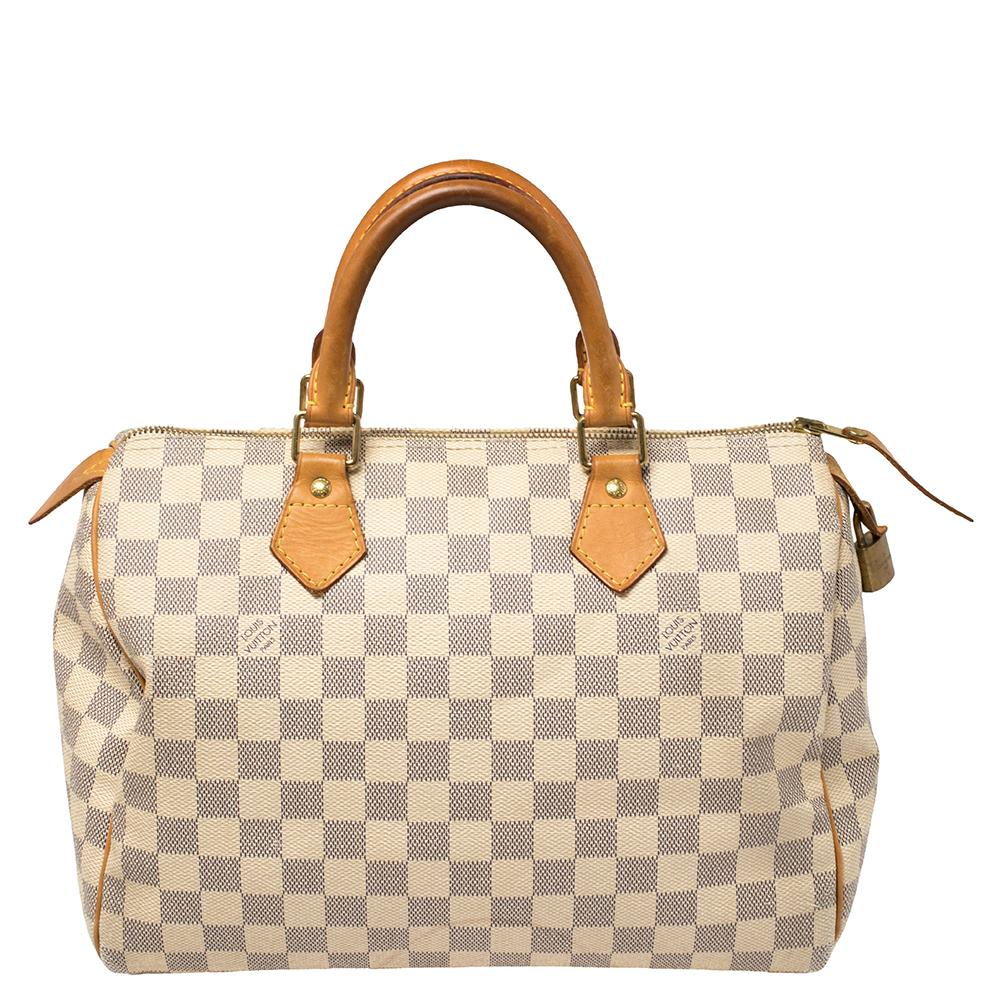 This bag by Louis Vuitton is an ideal option for keeping your daily essentials safe. Carry this bag to your next event for a statement-making impression. An impeccable pick of the season is this contemporary Damier Azur canvas bag with remarkable