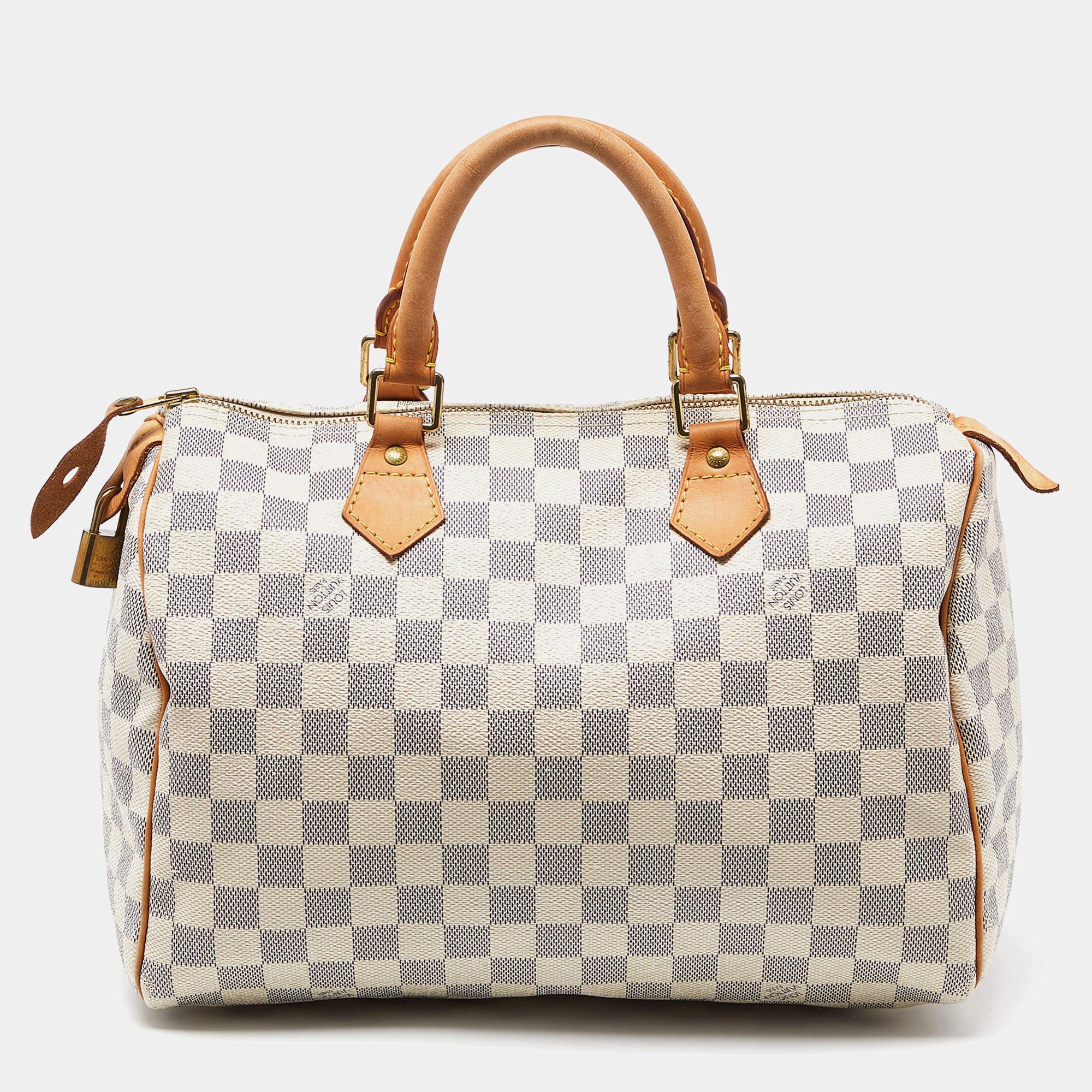 Louis Vuitton's handbags are popular owing to their high style and functionality. This bag, like all their designs, is durable and stylish. Exuding a fine finish, the LV Damier Azur Speedy 30 bag is designed to give a luxurious experience. The