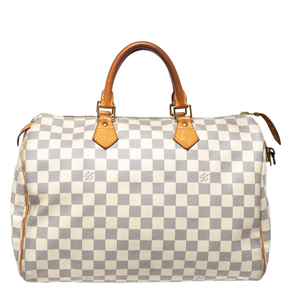 Titled as one of the greatest handbags in the history of luxury fashion, the Speedy from Louis Vuitton was first created for everyday use as a smaller version of their famous Keepall bag. This Speedy Bandouliere 35 is crafted from Damier Azur canvas