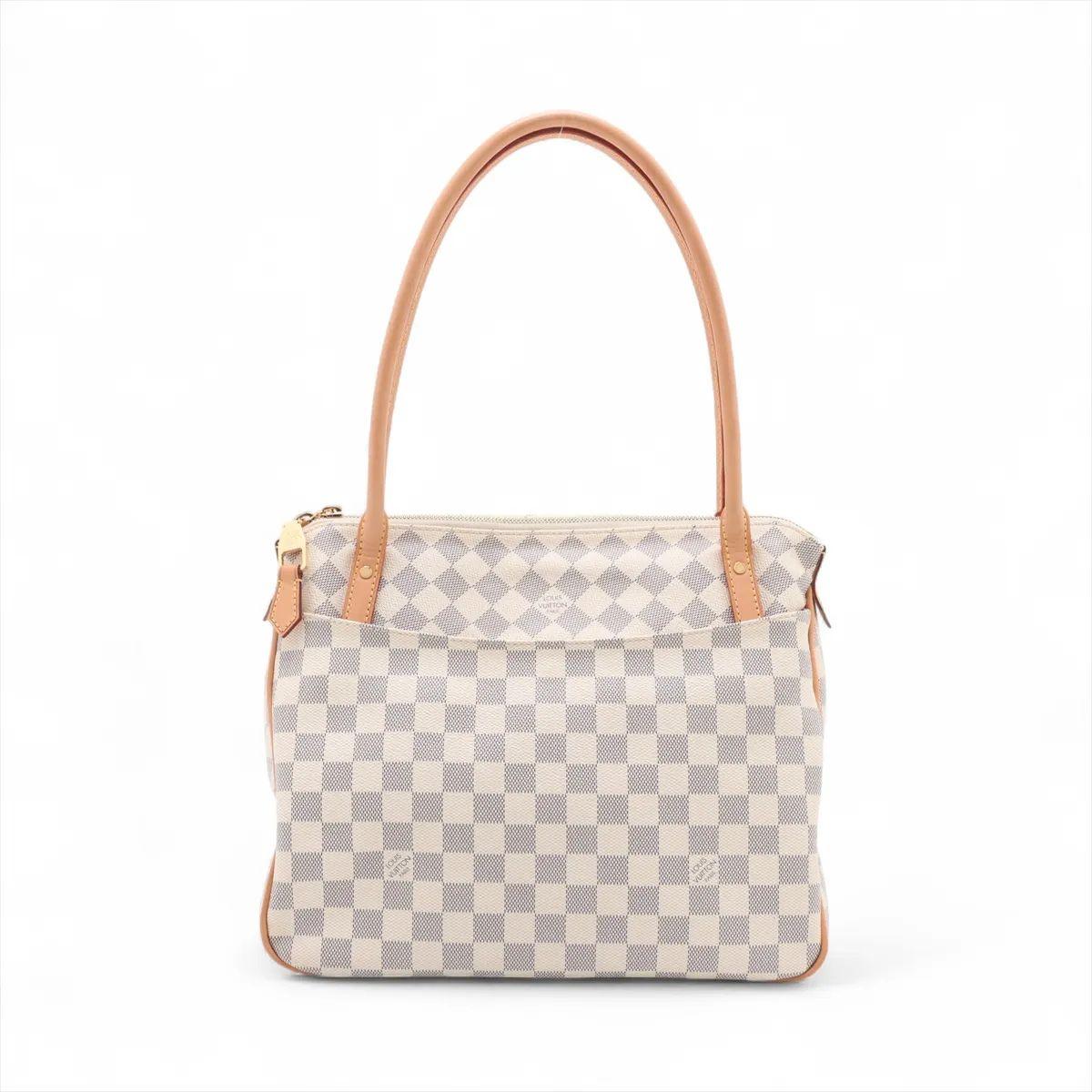 The Louis Vuitton Damier Azur Figheri PM is a chic and versatile tote that highlights a creative play on the maison’s iconic motif. Designed in a unique combination, it features panels of the Damier Azur canvas arranged in a striking diagonal