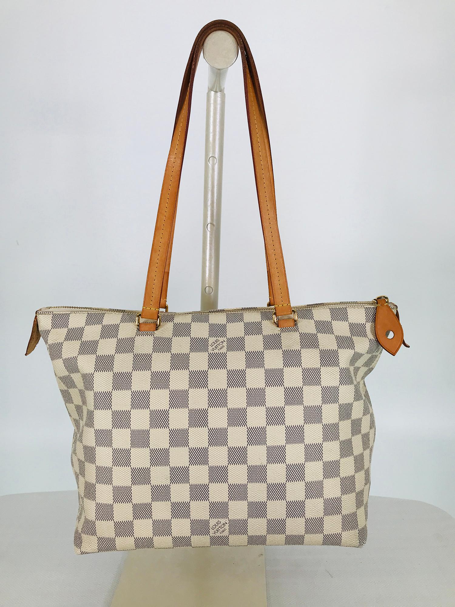 Louis Vuitton Damer Azur Lena canvas PM handbag. Coated canvas and leather, this Louis Vuitton bag is versatile, perfect for work or travel. Lightly structured bag has two vachetta leather handles with matching pull tabs and accents + gold brass